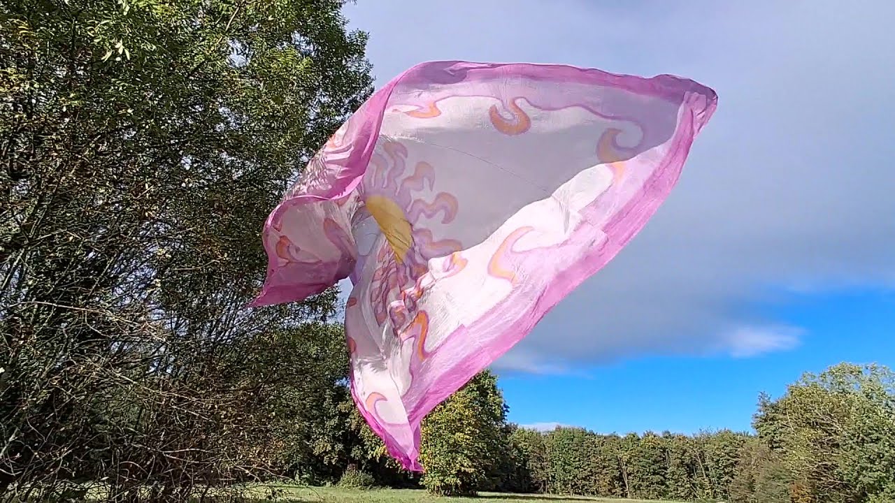 Delicate silk piece flutters gracefully in the strong wind