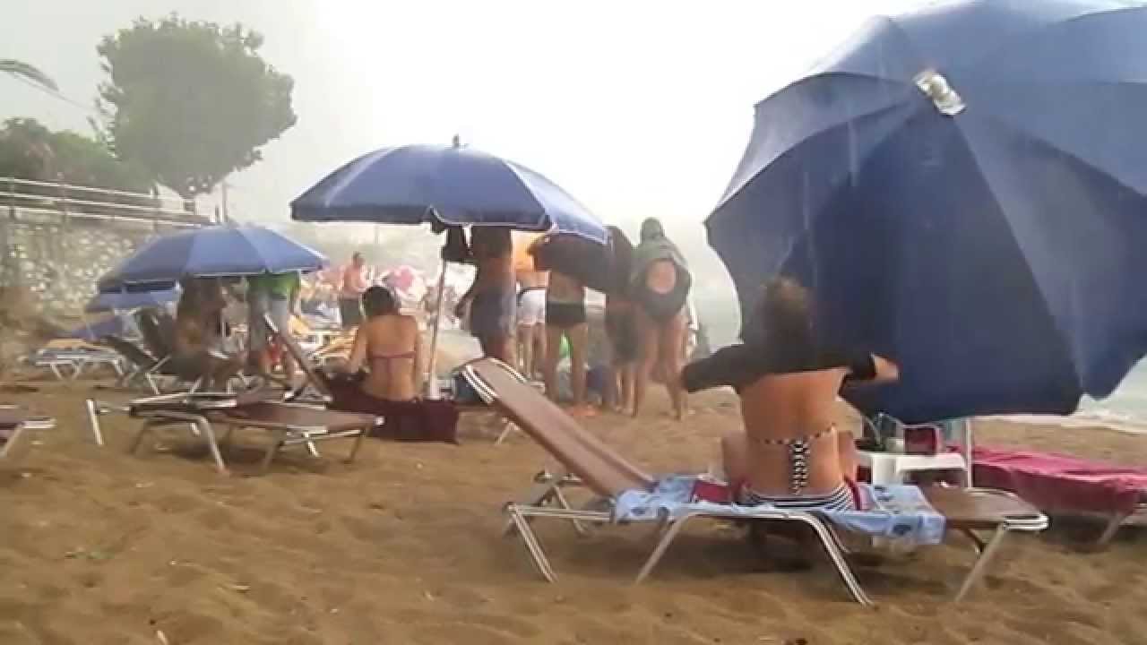 Stoupa. Sudden thunderstorm on main beach. 1st August 2015