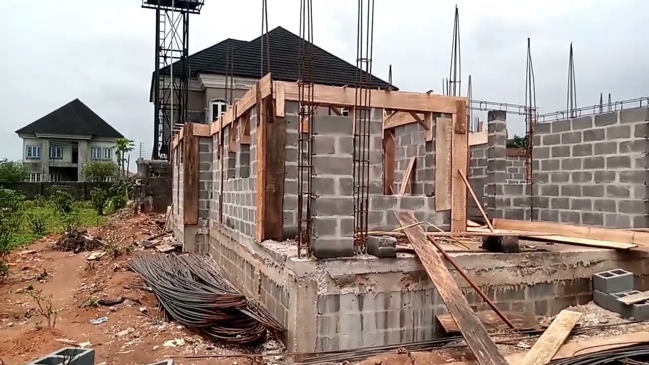 House construction activities, laying of block wall to lintel level