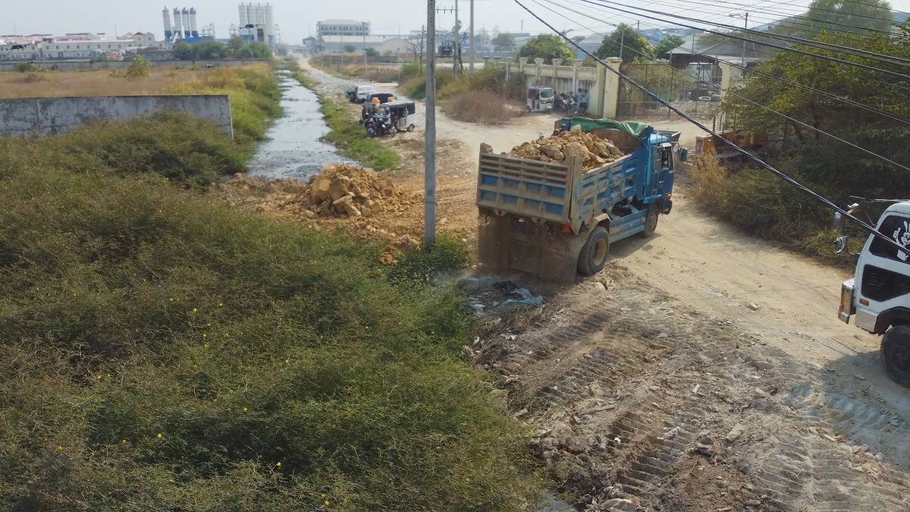 Great Start! Skilled Work in Action! Bulldozer and 6-Wheel Dump Trucks Filling Flooded Land