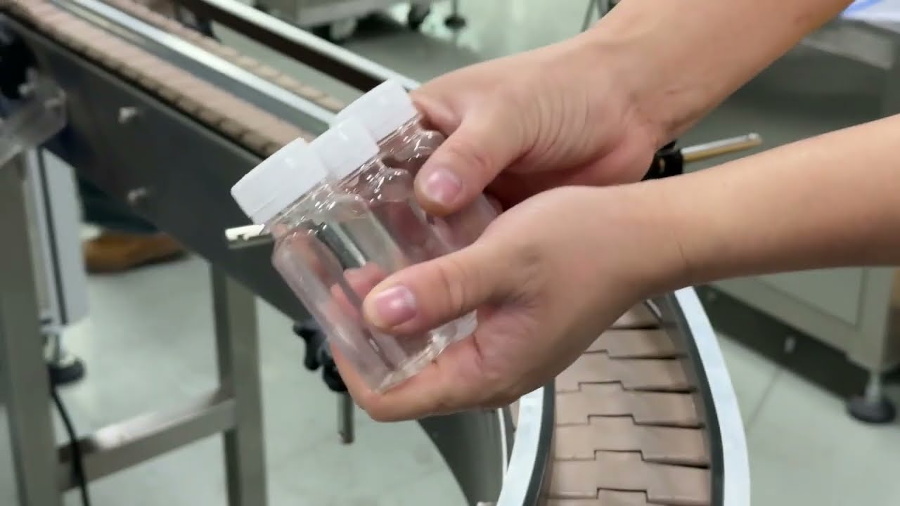 Gravity filling and screw capping machine for easy flow liquiid