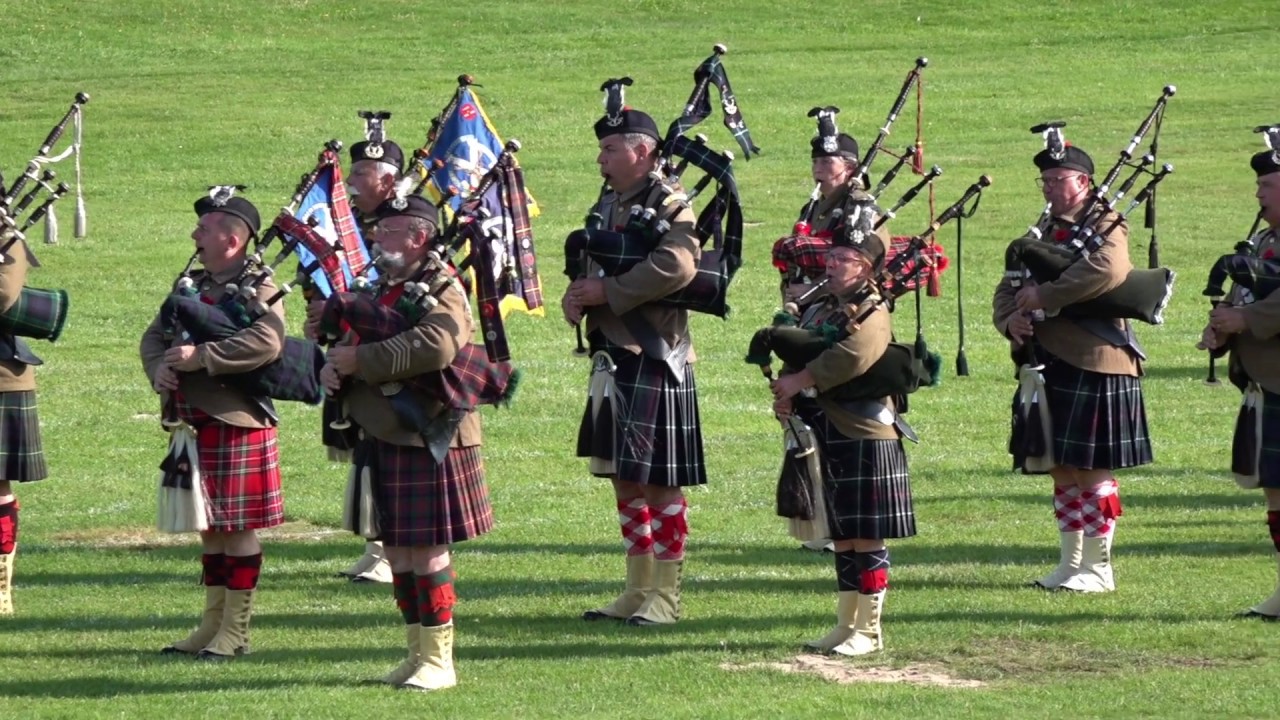Somme Battlefield Pipe Band from France Beating Retreat as guests at Aboyne Highland Games 2019