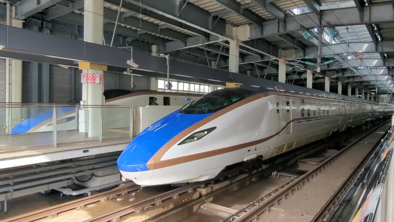 2026年2月10日北陸新幹線金沢(駅)11番のりば到着→停車E7系F34編成運行562Eはくたか562号 12番のりば停車中→発車W7系W10編成運行12Eつるぎ12号→(回送列車)回送2201E