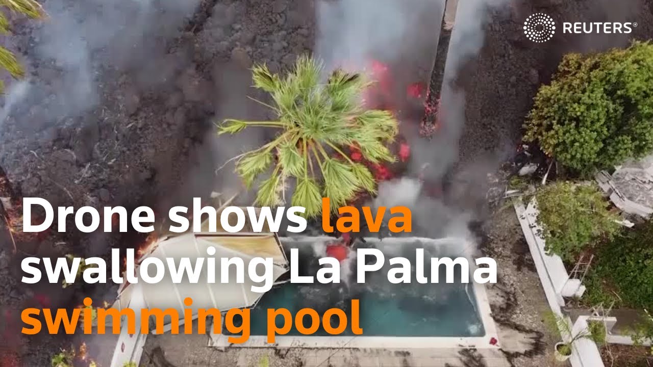 Drone shows lava swallowing La Palma swimming pool
