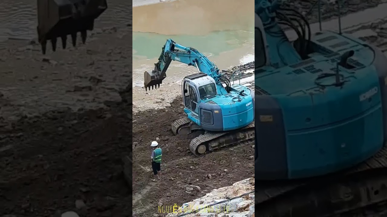 Xem máy xúc đào hố dưới lòng sông.