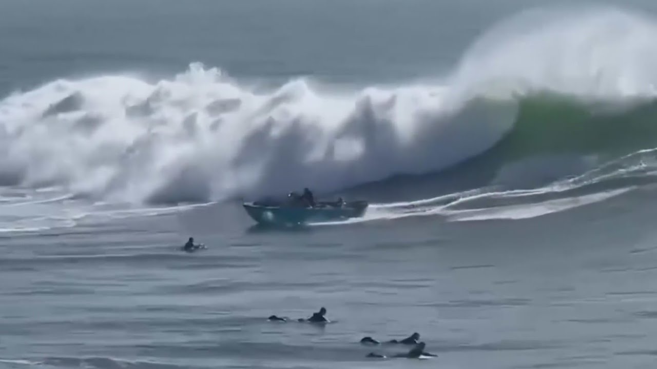 Terrifying video captures moment when massive wave flips boat with family on board
