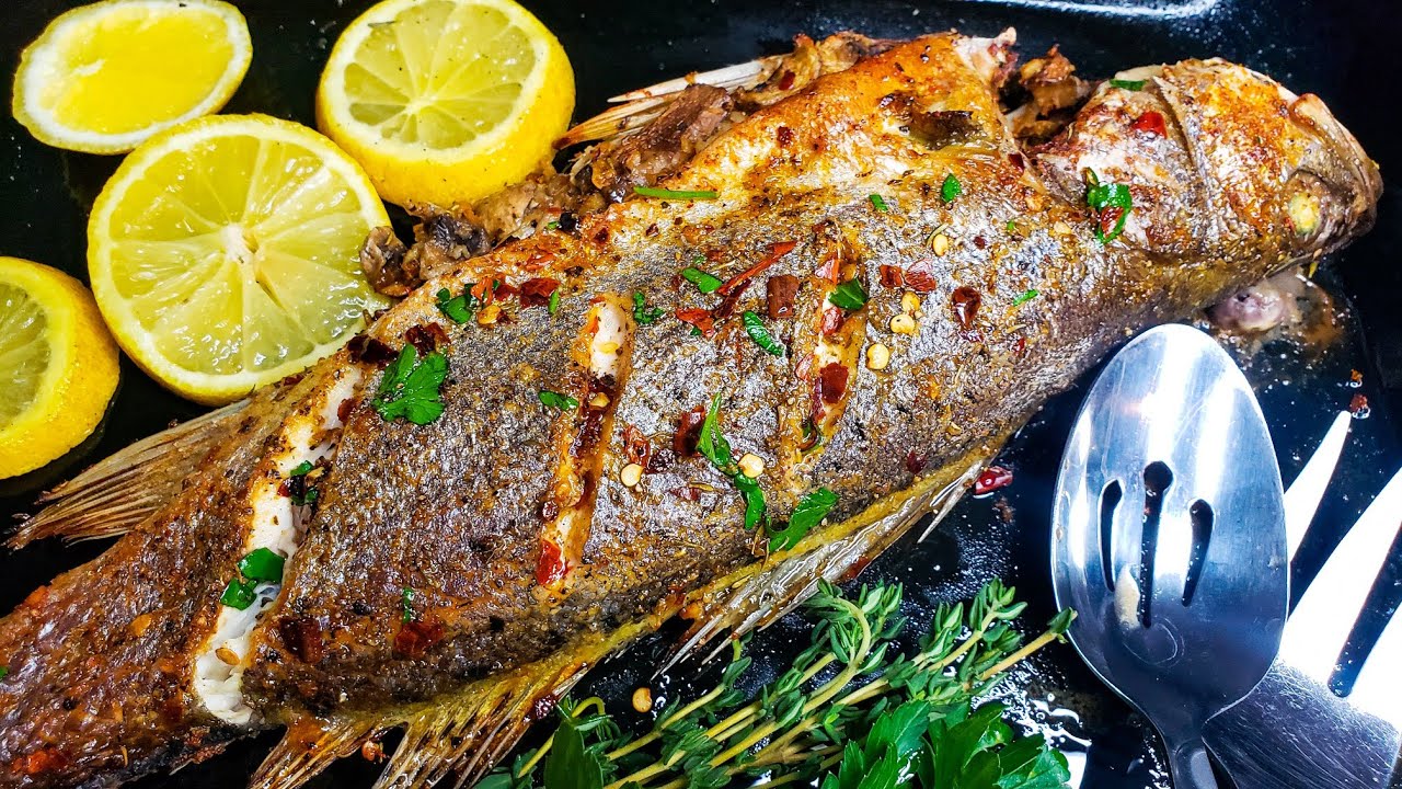 Идеальный и ВКУСНЕЙШИЙ морской окунь, запеченный в духовке и фаршированный грибами с чесноком.