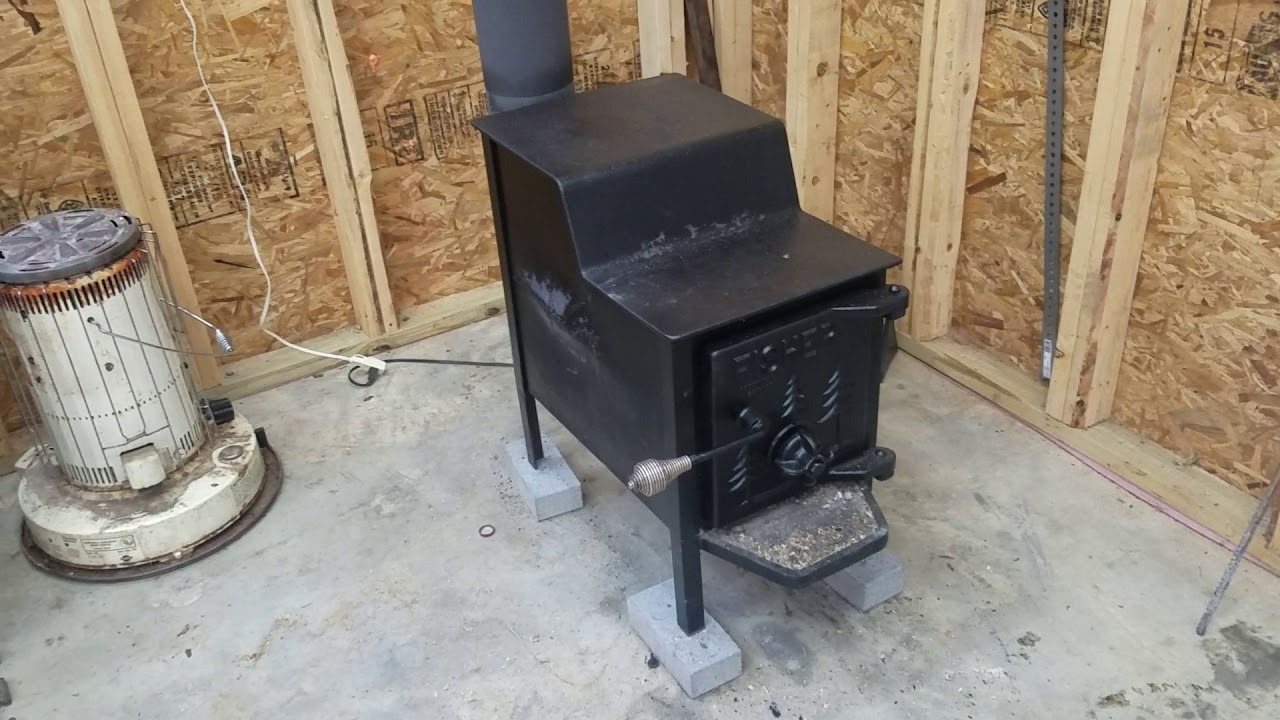 Fisher baby bear wood stove and chimney pipe installation