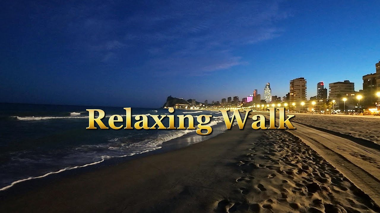 A relaxing walk on a sandy beach at night in 4K UHD