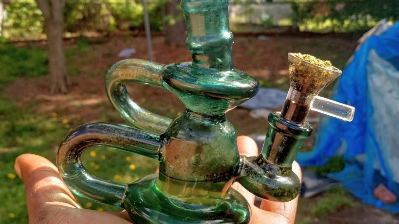 smoking pure indica chocolate Kush out of mini bong.