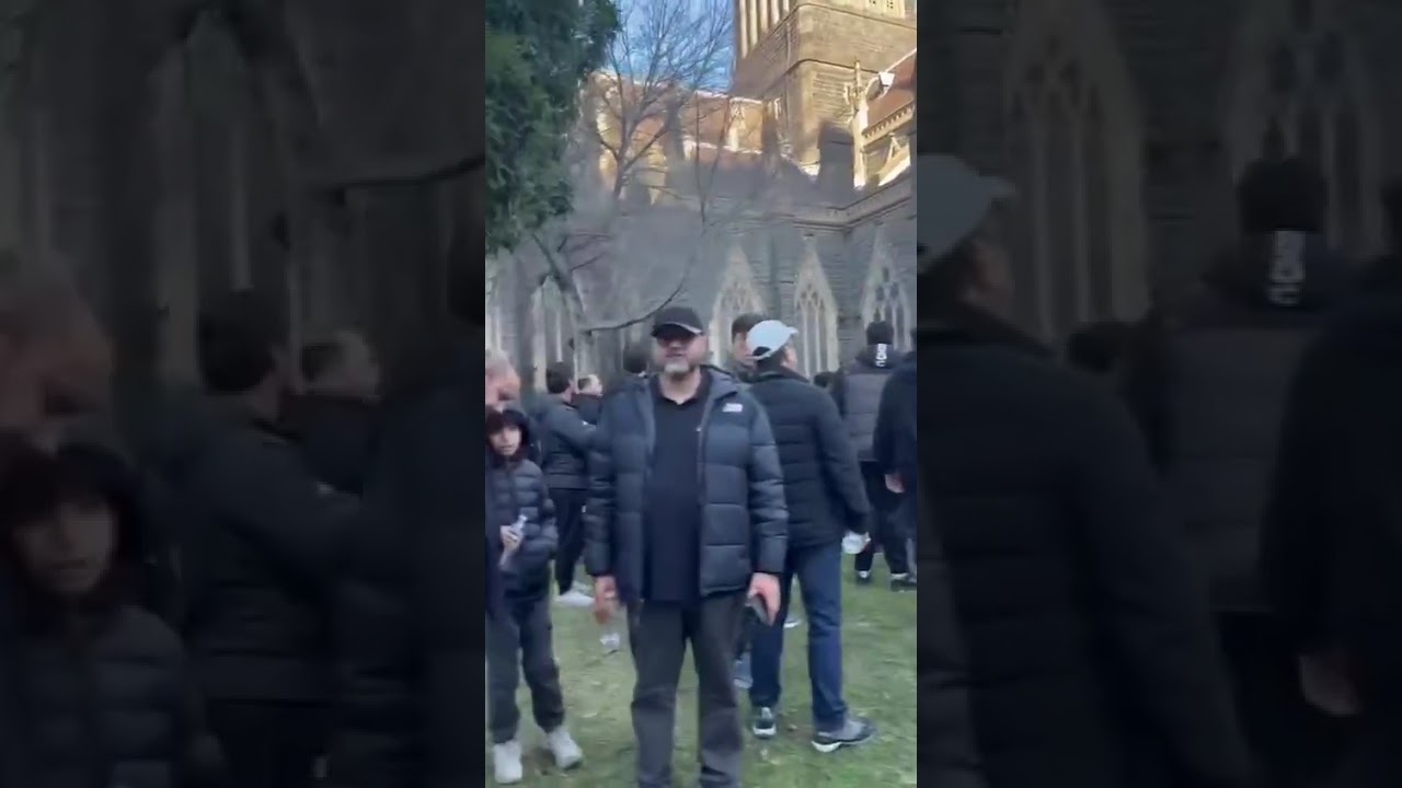 Muslims surround the biggest Cathedral in Melbourne Australia.