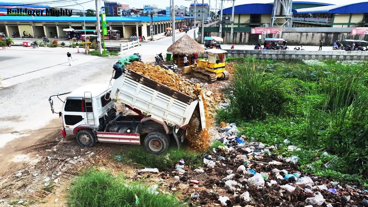 Opening New Project, Bulldozer KOMATSU D31P Work, Dump Truck Unloading, Filling Up The Land huge
