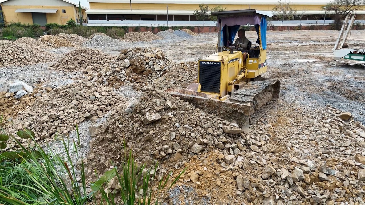 Amazing Heavy equipment working in perfect teamwork, powerfully moving stone and soil.