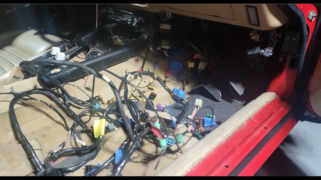 1992 Jaguar XJS rear seat, center console, and ECU wiring harness removal.