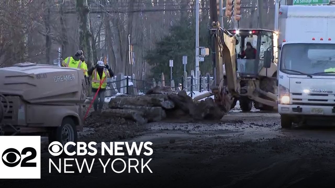 Crews on the scene of a water main break in Millburn, N.J.