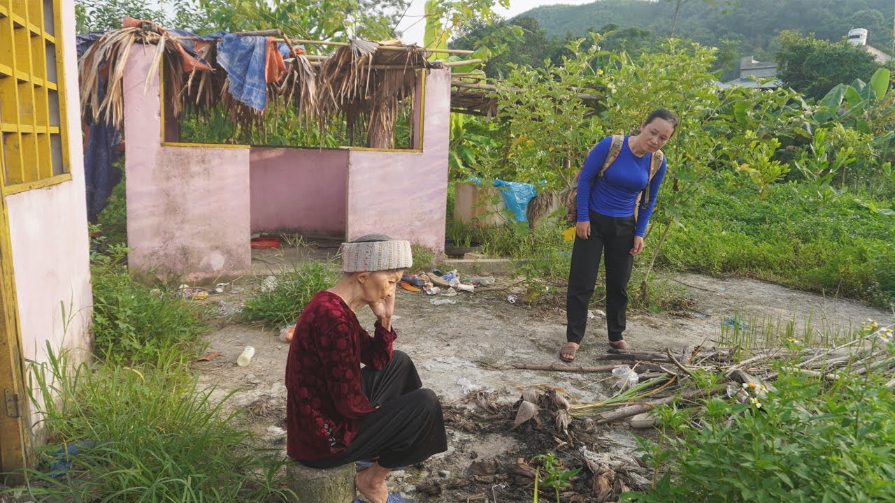 The girl helped the 85 year old woman build a bamboo house, clean it, and give her food.