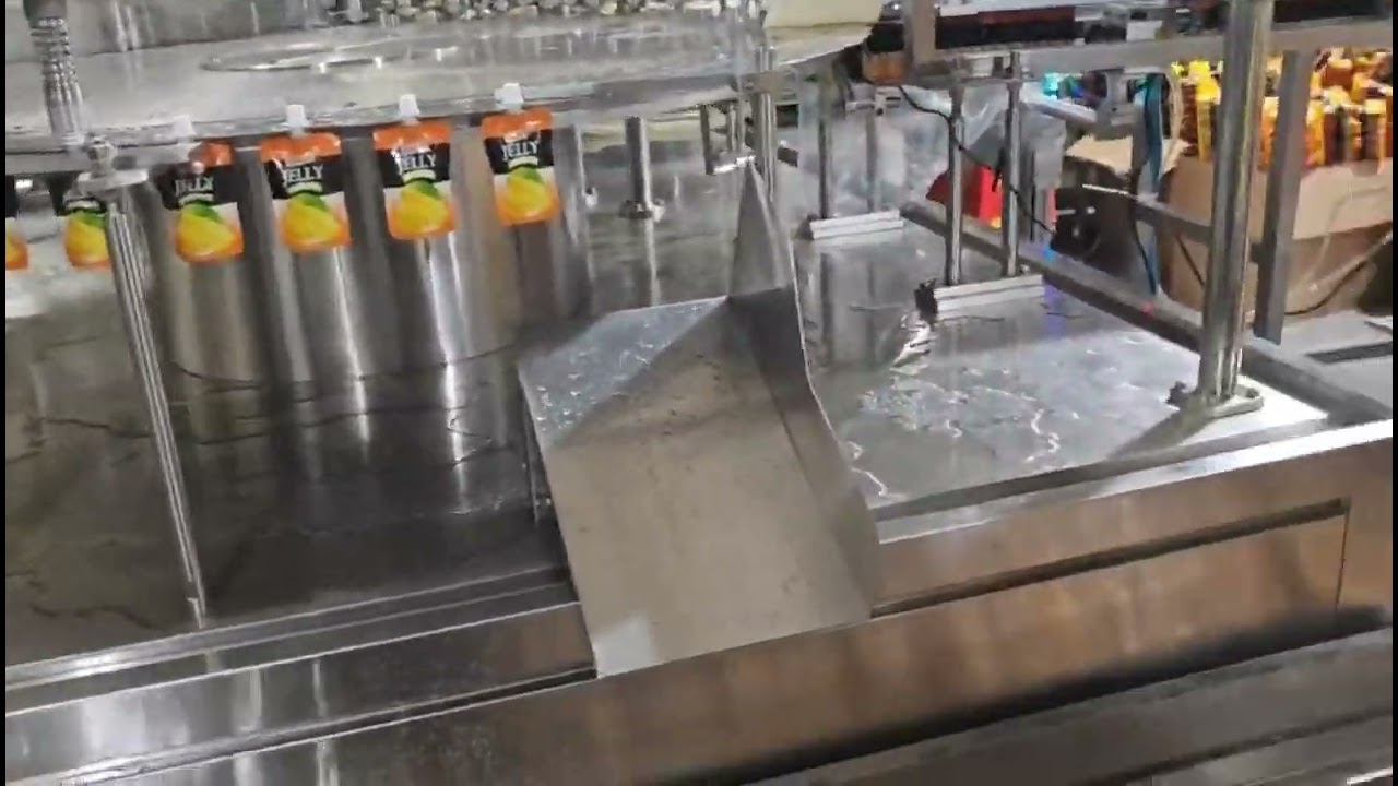Suction nozzle self-standing bag filling and capping machine
