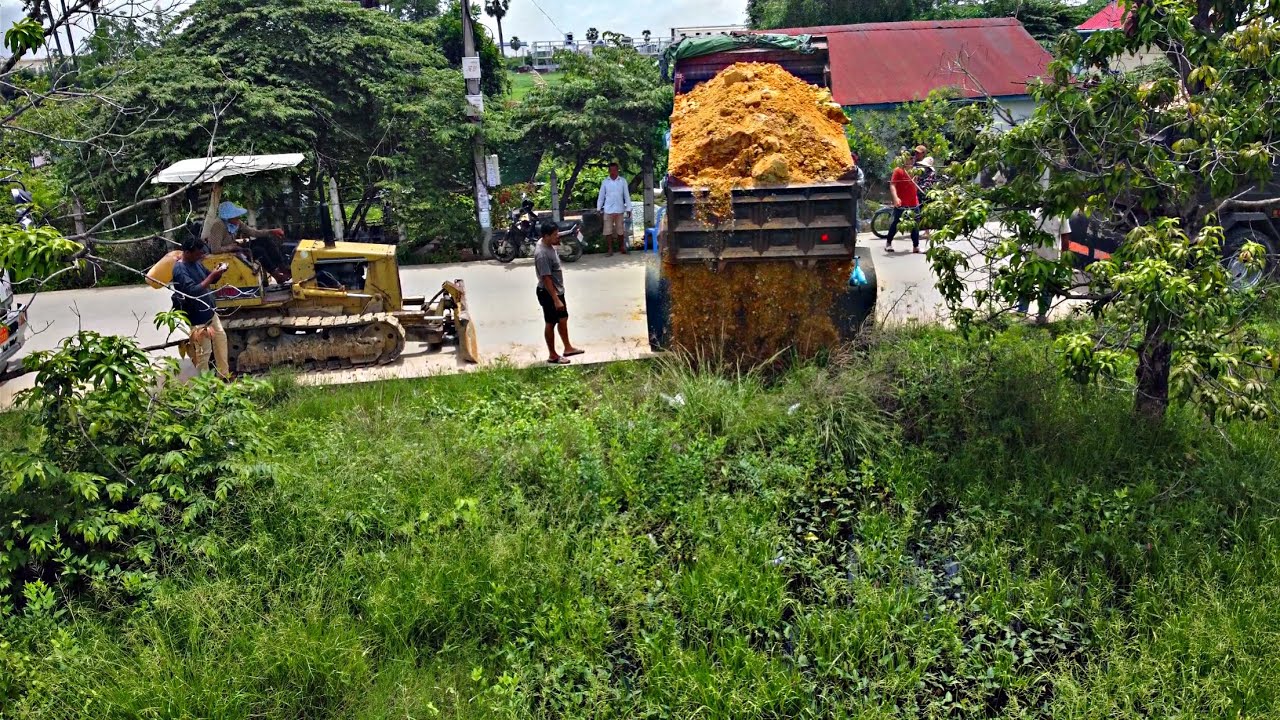 Starting Opening New project!! Bulldozer KOMAT'SU D20P pushing soil into swamp with 5ton Trucks