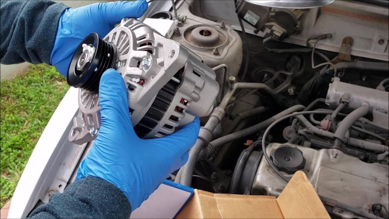 Como cambiar el Alternador y la Correa en  Mitsubishi  Mirage. How to replace Alternator and Belt.