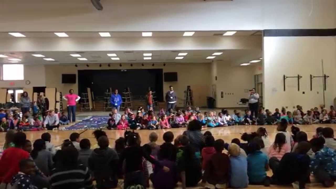 Parker Woods students, staff, and parents sing a twentieth anniversary Happy Birthday to their schoo