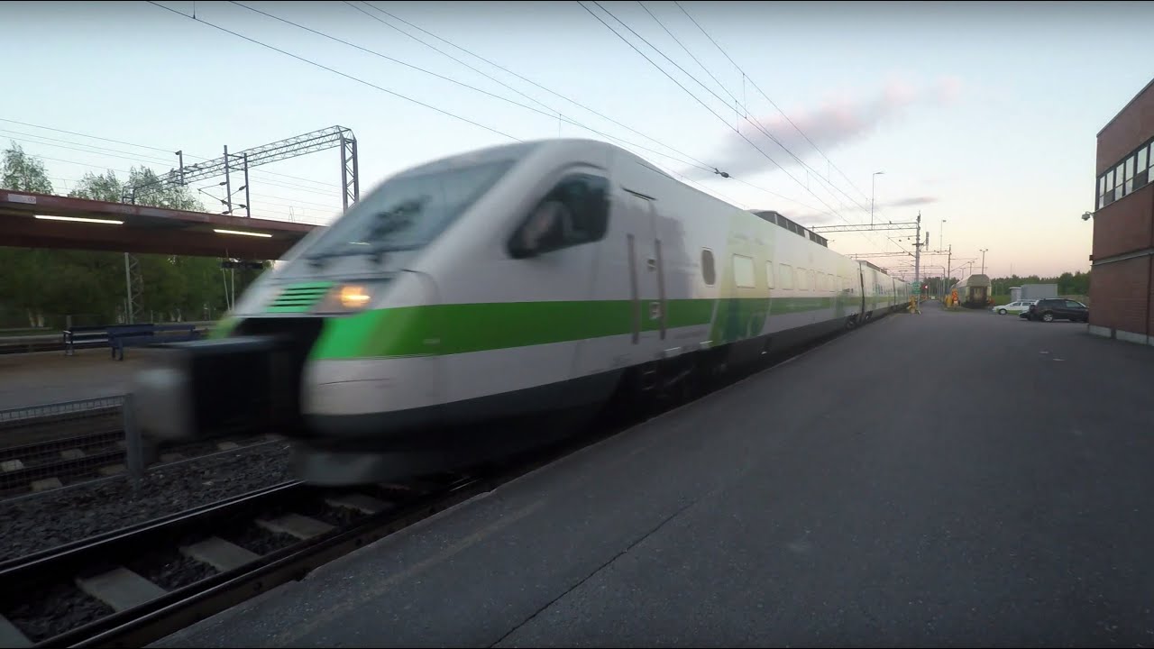 Pendolino train arrival and departure Pieks&auml;m&auml;ki railway station 4K video