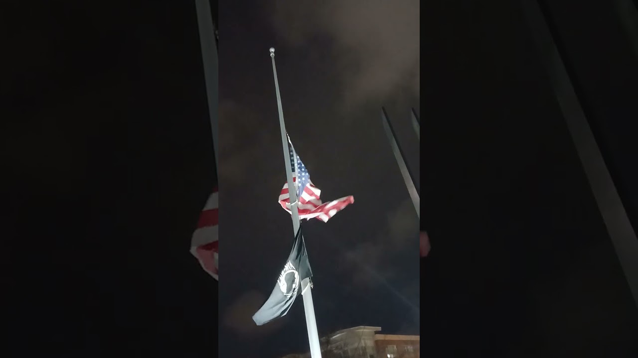 I went by the memorial. These two flags are flapping in the Wind. But the USA flag is ripped.
