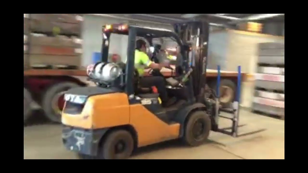 Forkilift Driving Loading Full Bins Onto Flatdeck