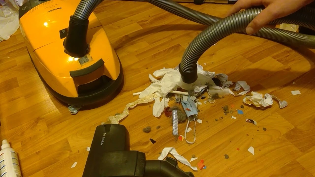 Vacuuming up trash, gloves etc