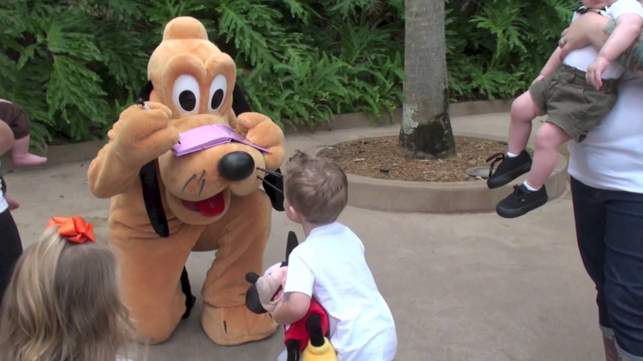 Super Excited child meets Pluto at Walt DisneyWorld