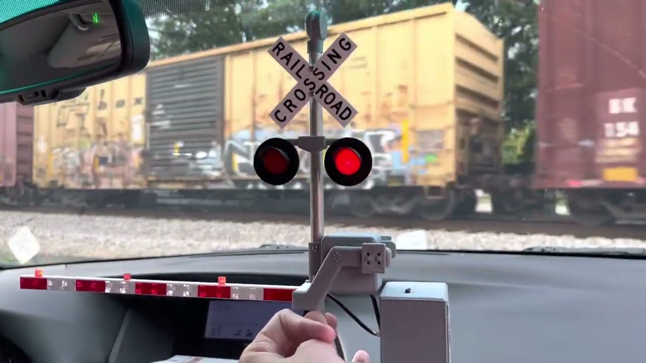Csx q602 passing through Auburn Alabama with railroad crossing gate toy from 1bdrworkshops