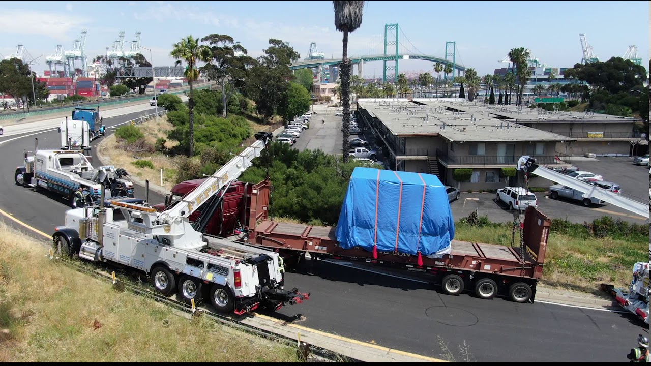 Trailer with 60,000lb machine load almost tips over on freeway