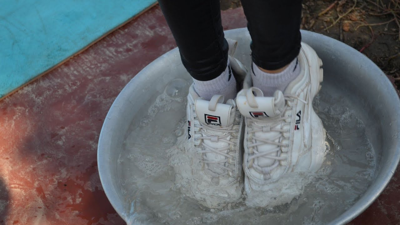 Wetlook Girl has her FILA's full of water again
