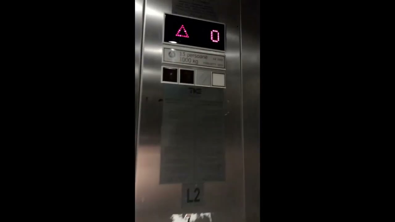 2 ThyssenKrupp MRL lifts and a plane taking off from Bucharest Henri Coandă International Airport.