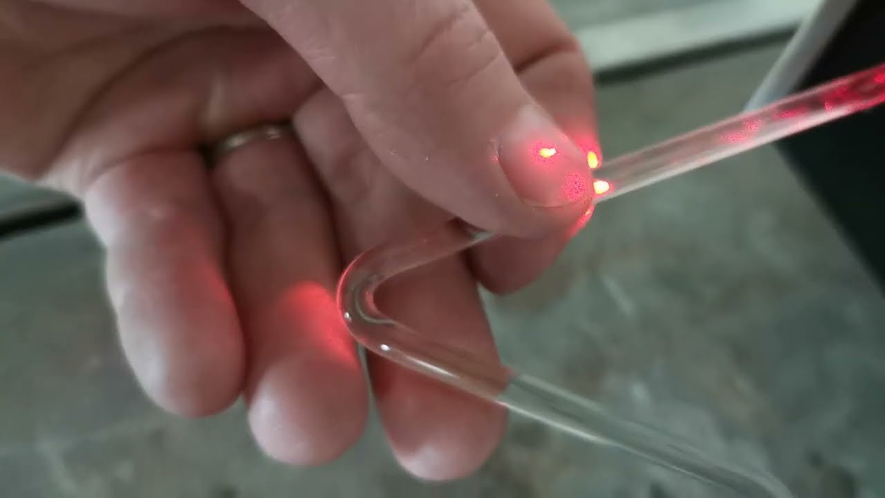 Total internal reflection in pouring water and a bent glass rod