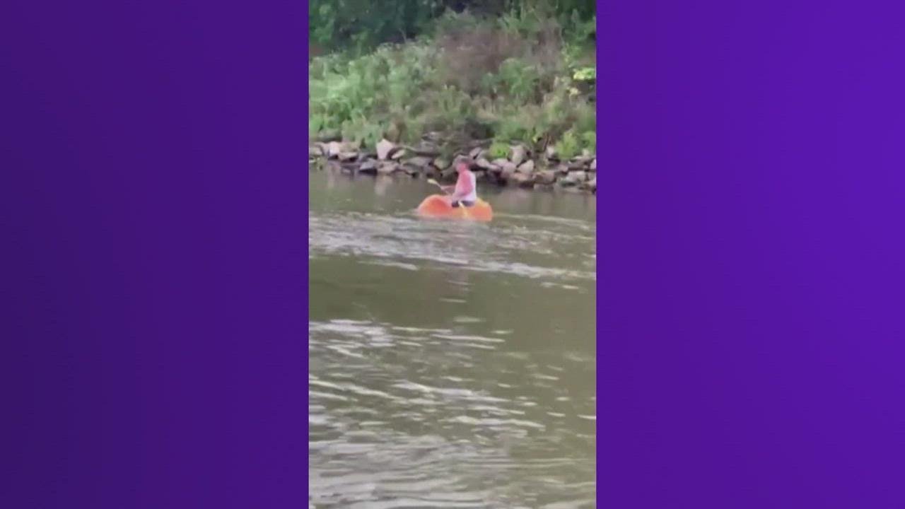 Pumpkin grower paddles giant gourd down river hoping to break Guinness World Record
