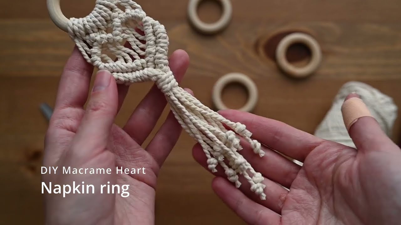 DIY macrame napkin ring in the shape of a heart.