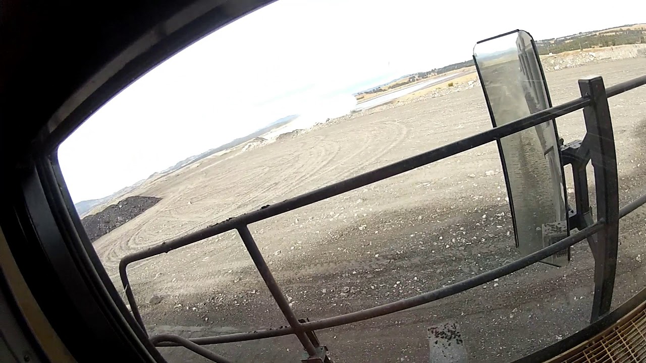 Cat 789D Pov of Walk around, Backing under the digger & driving to dump