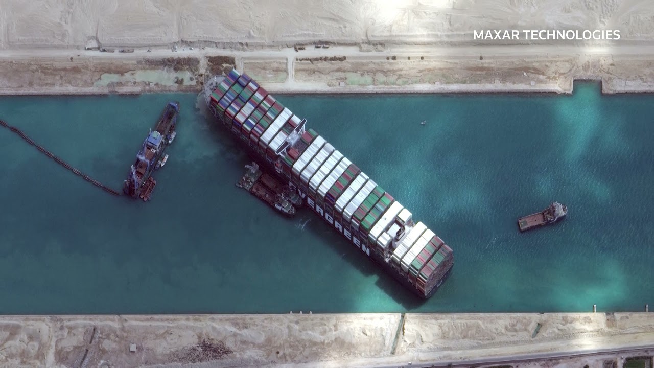 Dredge or tug? Suez authority tries to free stuck ship