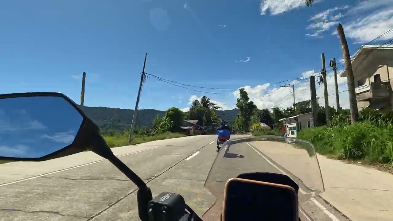 POV Ride up North town of Pagudpud, AH26 Pan-Philippine Highway along Pasaleng Bay