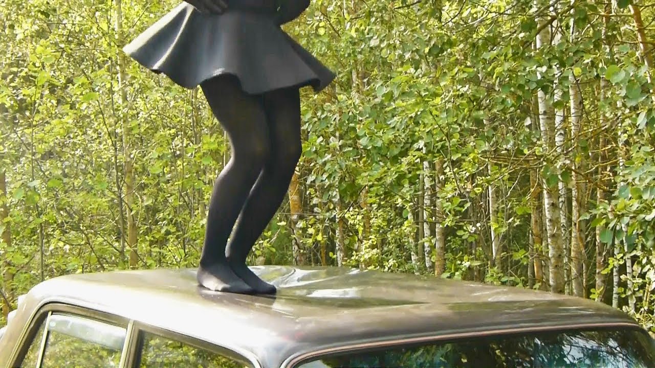 Jumping on the roof of a car in pantyhose