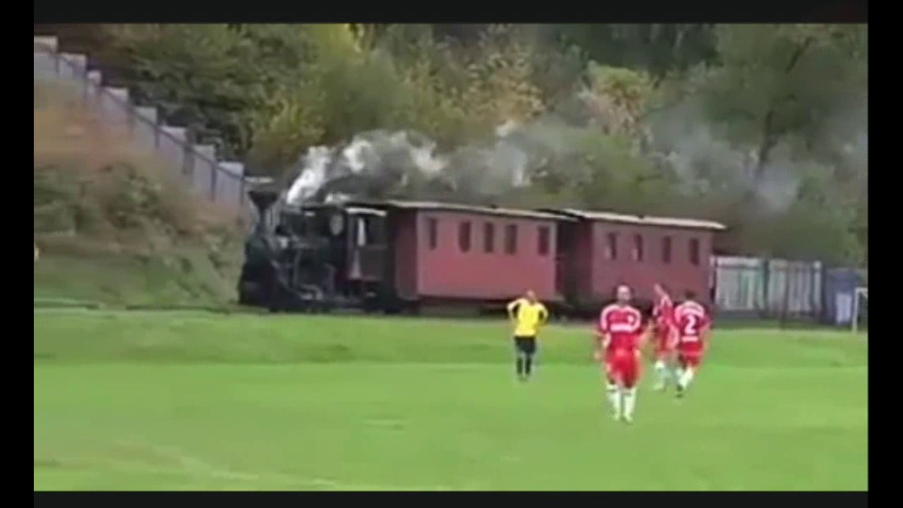 A train passes through a football pitch