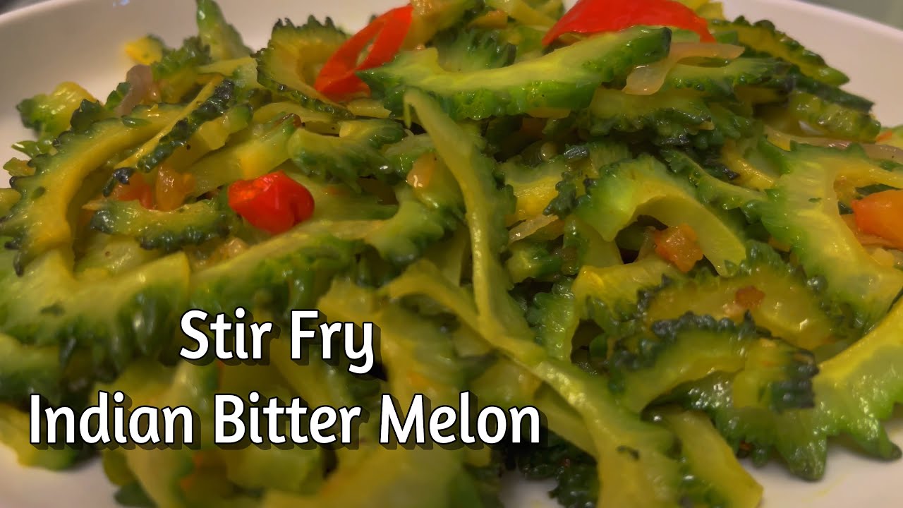 STIR FRY INDIAN BITTER MELON. ALSO KNOWN AS KARELA, MELON AMER, PARE, CARASEE, AMPALAYA AND GOYA.