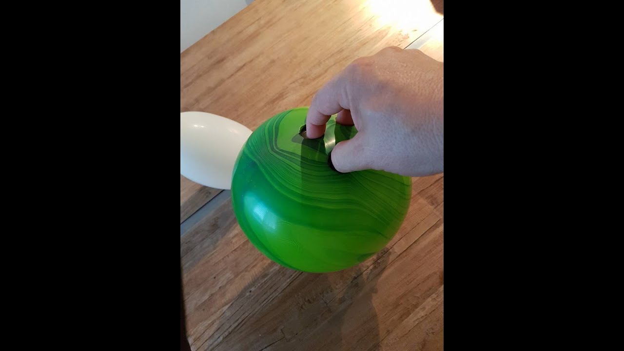 how do i make three holes in a balloon for a bowling ball