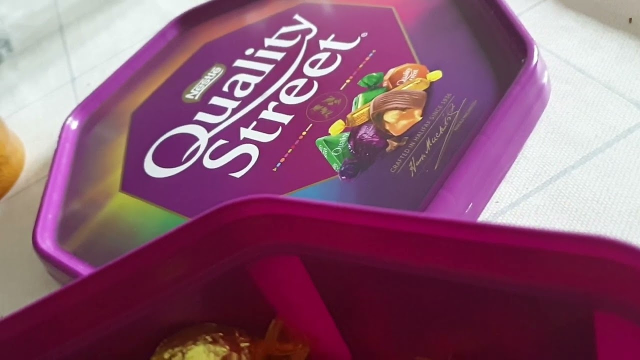 Ayaan checking all flavours of the Quality Street Chocolate