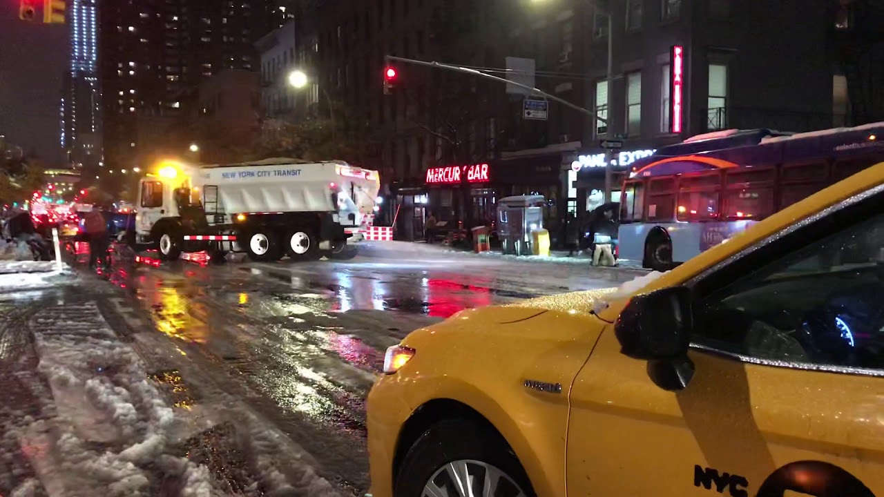 RARE CATCH OF A NEW YORK MTA TRANSIT SALT SPREADER/PLOW TRYING TO GET A CITY BUS OUT OF A ICY PATCH.