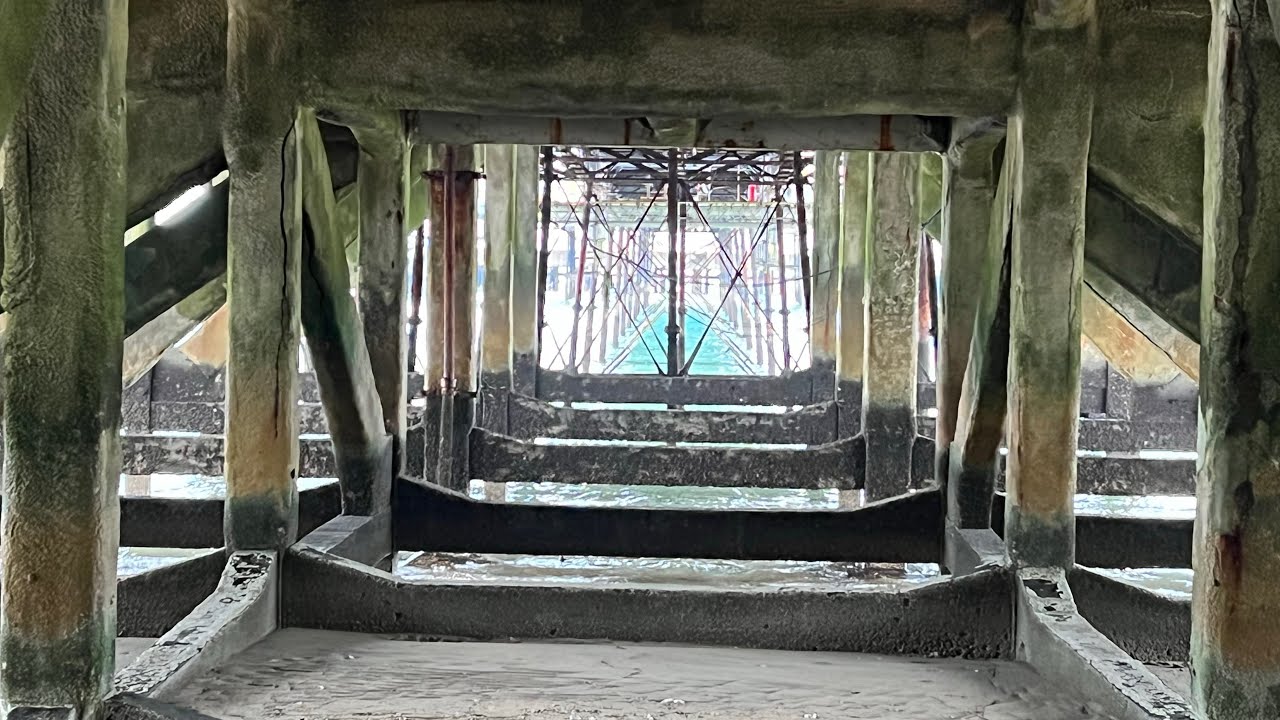 Enjoying a short walk along Sandown Beach and under Sandown Pier, Isle of Wight, January 2022