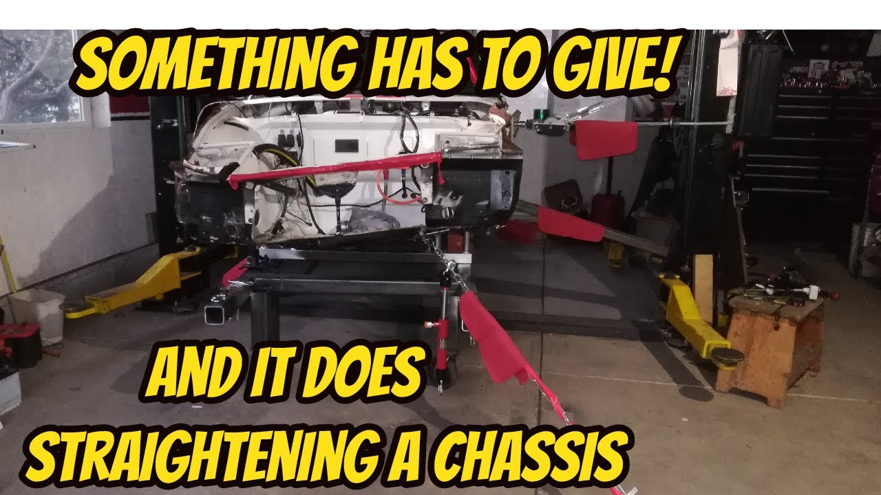Pulling a wrecked Porsche 914 chassis back into shape.