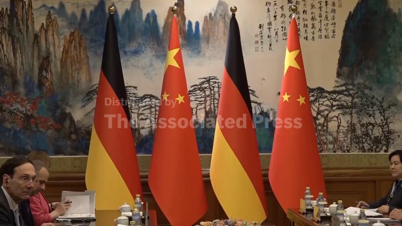 German leader presses China's top leaders for fair trade as he makes first official trip to Beijing