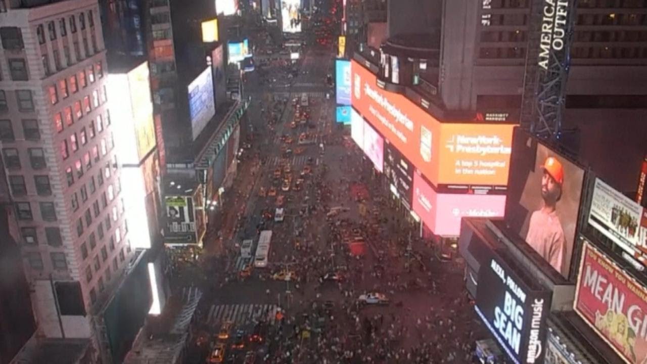 Tourists Jump on Stage in Times Square Scare