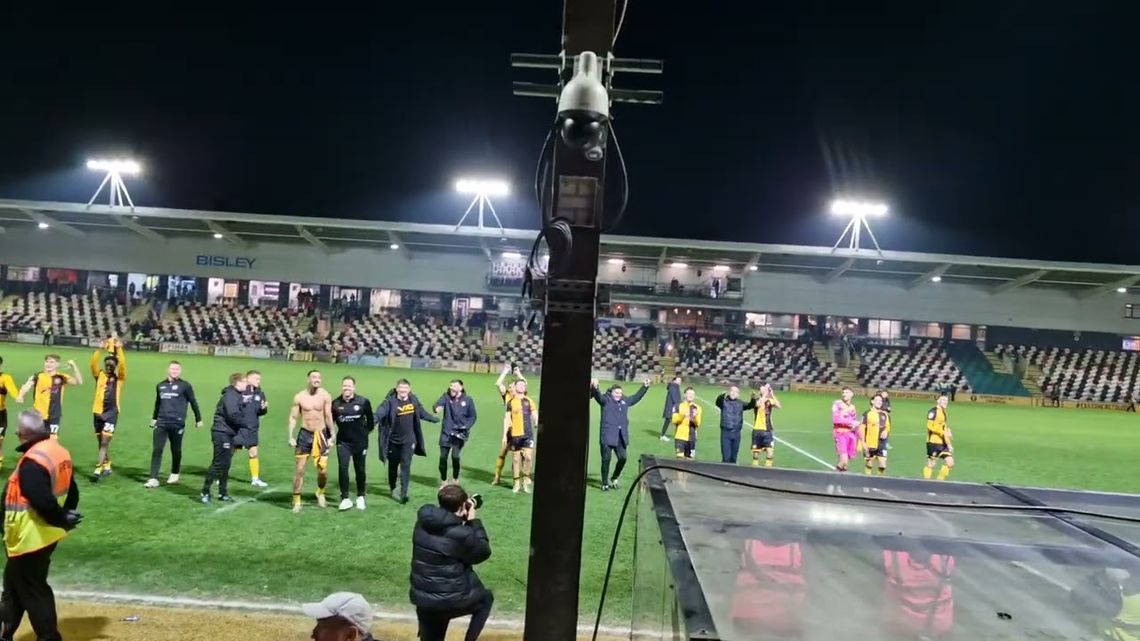 Newport team celebrate with fans after home win v Tranmere 